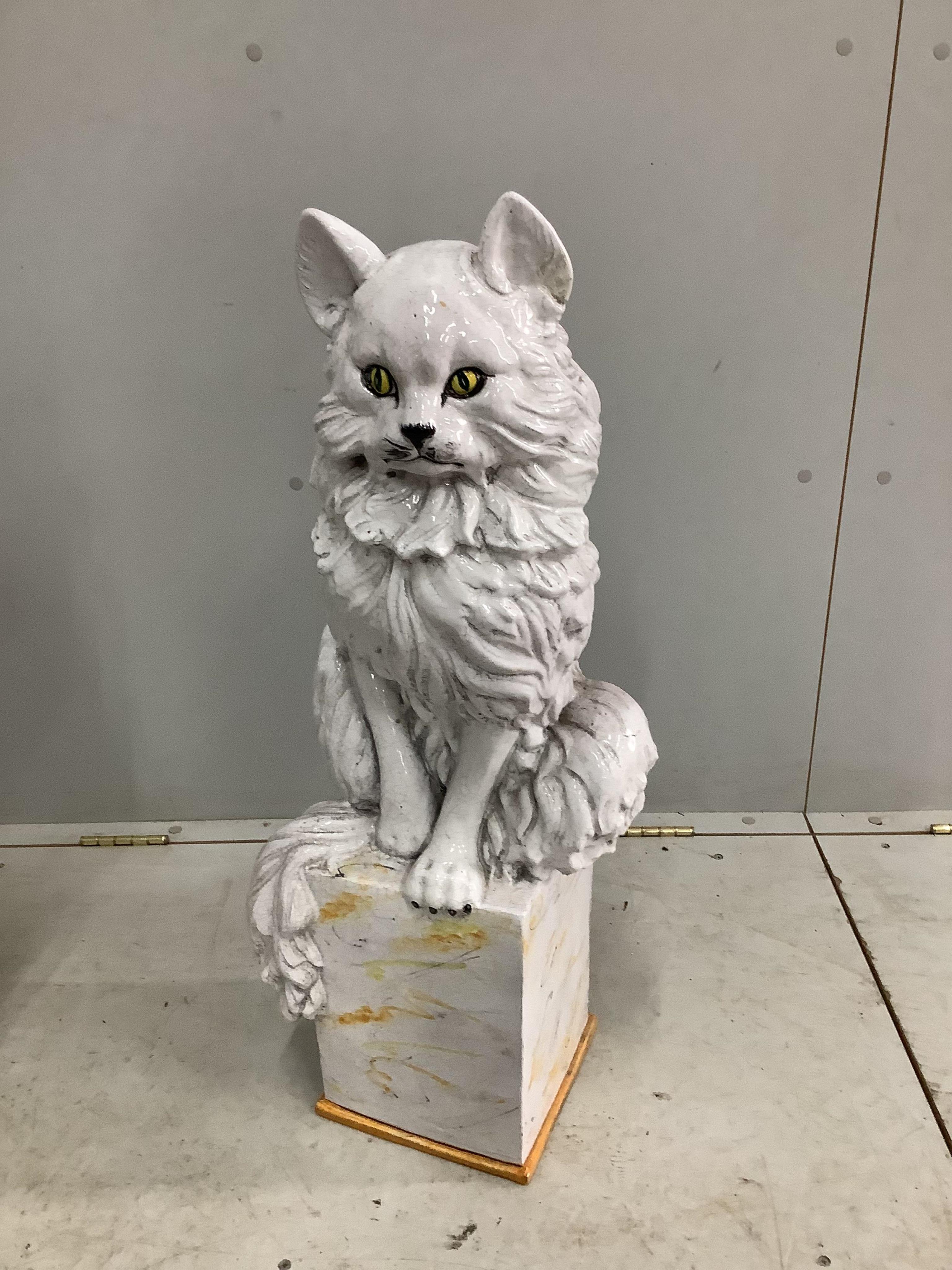 A pair of Italian white glazed ceramic models of seated cats, height 83cm. Condition - fair to good